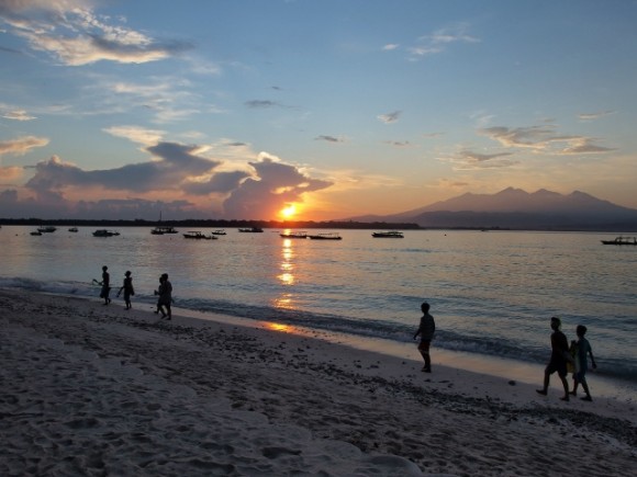 Walking in the dusk with the music of the waves