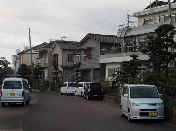 Terrace houses and boxy passenger vans