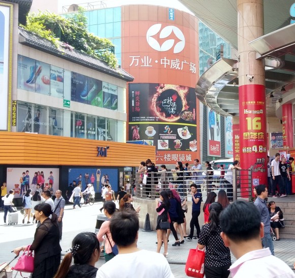 Shenzhen: shops, noise, shouting, people, sales.