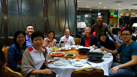 Church folks in the hiking group have dinner with the Chong family and Vincent.