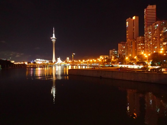 Macau by night with the tower standing like a shining needle