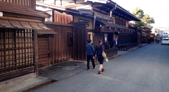 Walking along historically old houses on both sides of the street